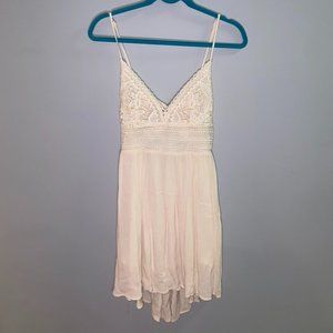 South Moon Under cream colored sundress with tie-back. Size small.